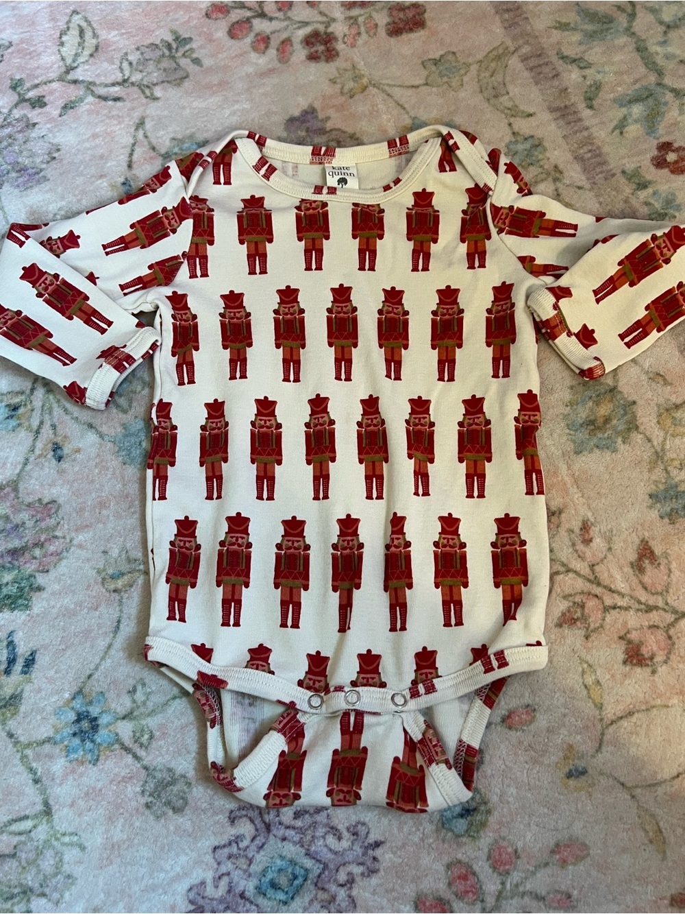 kate quinn White Onesie with Red Nutcracker Print